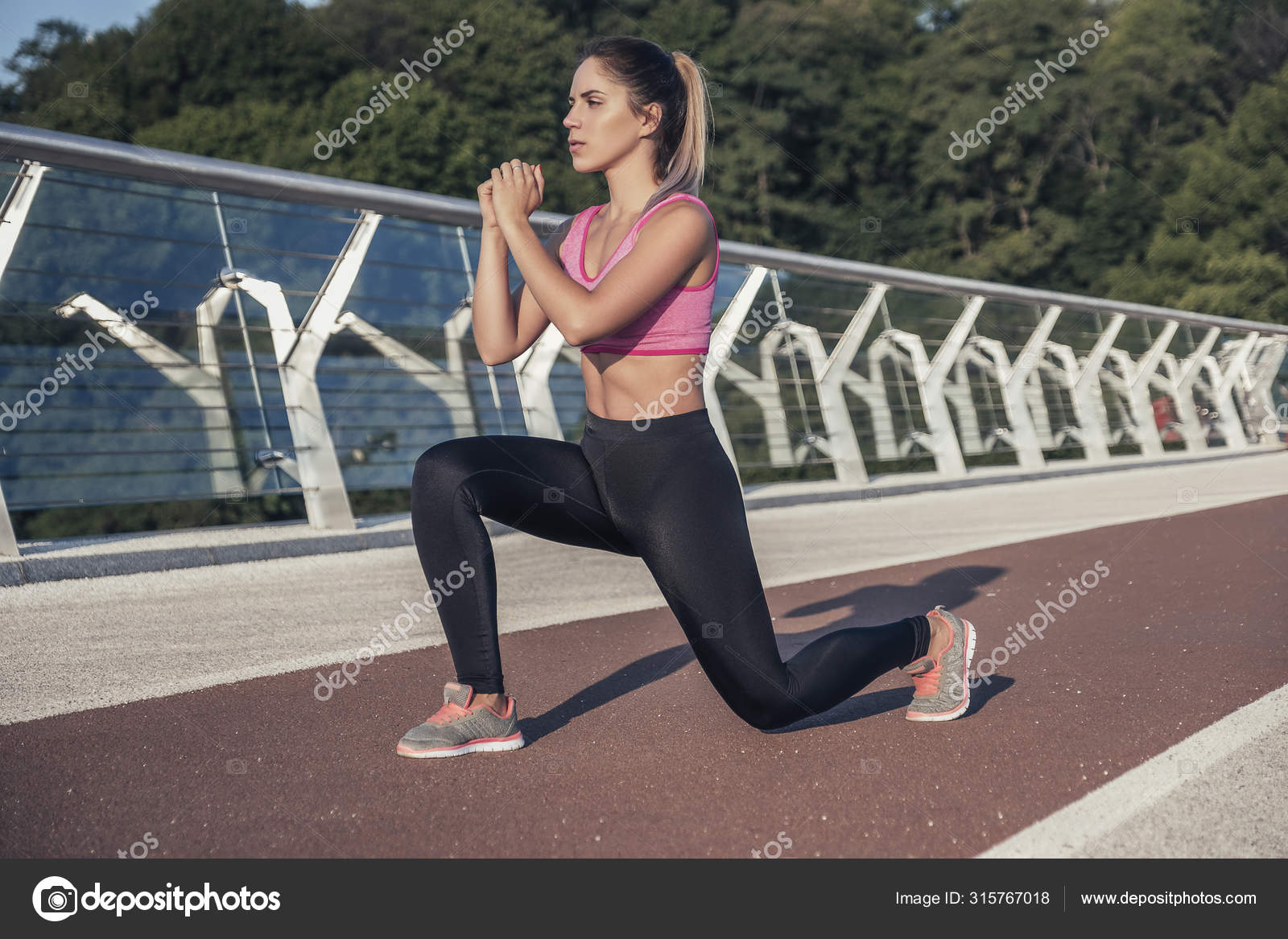 Slim fit caucasian brunette woman outdoor exercising in sport ou Stock Photo Annademy 315767018