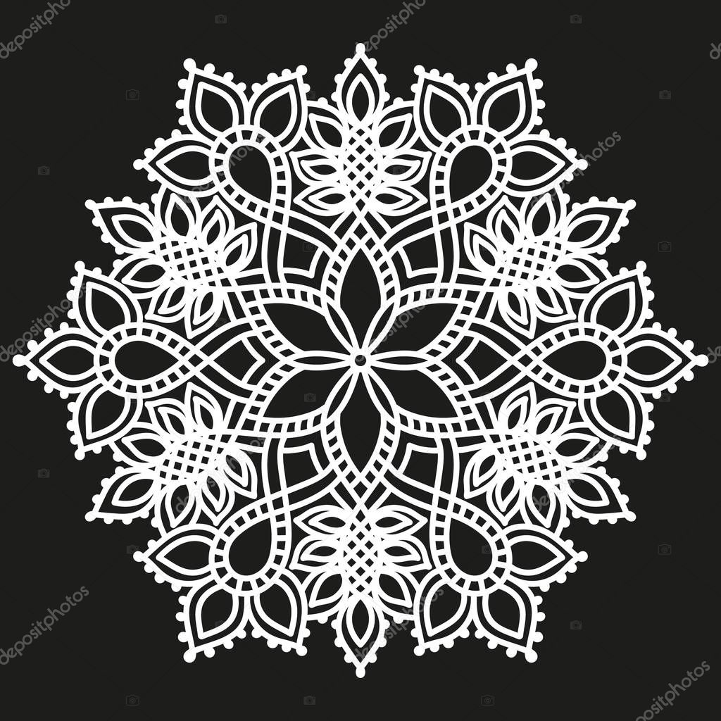 white round symmetrical pattern on black. fancy decorative mandala