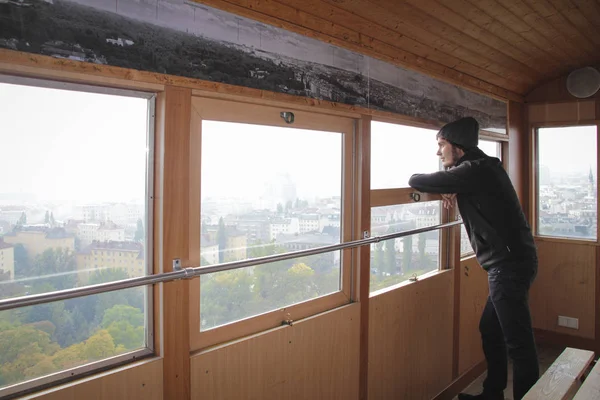 Young Man Hat Looking Window Wooden Cabin Famous Giant Wheel — Stock Photo, Image