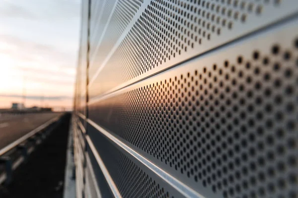 Protection of residents against noise generated by vehicle traffic. Close-up of noise-absorbing protective panels.