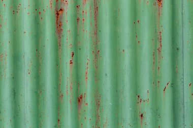 Oluklu metal dokusu veya pas, yeşil renk, soyut arkaplan kalıntılarıyla demir çelik dokusu.