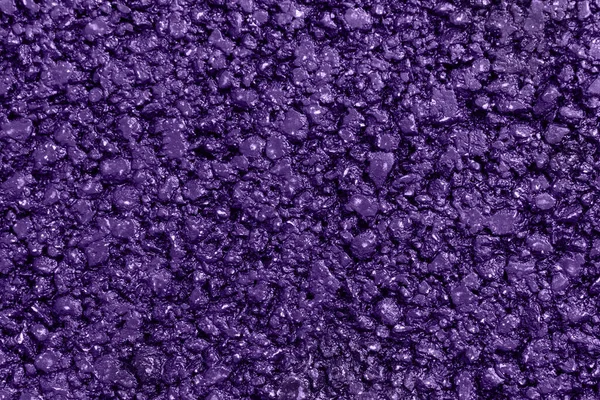 New violet asphalt. Textured, background. Flat lay. Close up.