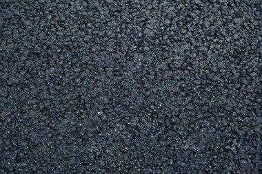 Yeni asfalt. Doku, arka plan. Düz yatıyordu. Kapat..