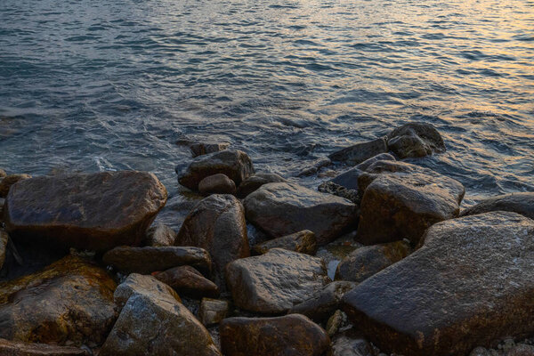 Large stones on the seashore washed by water