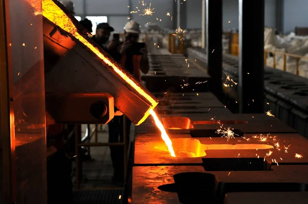 Casting melted iron in a mold