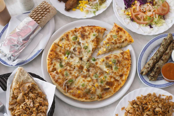 PIzza doner, variety of dishes of Asian origin