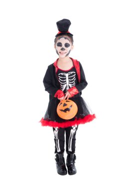Full length of girl in skeleton costume holding halloween pumpkin bucket,standing and smiles  clipart