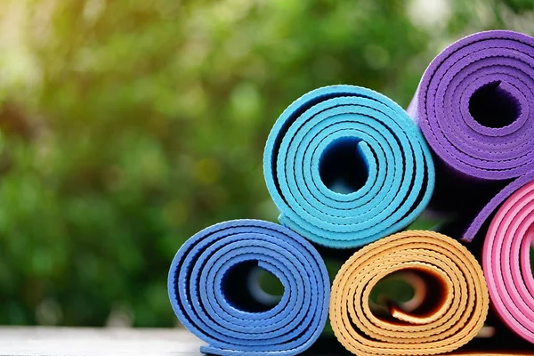 yoga mats on table, fitness healthy and sport concept