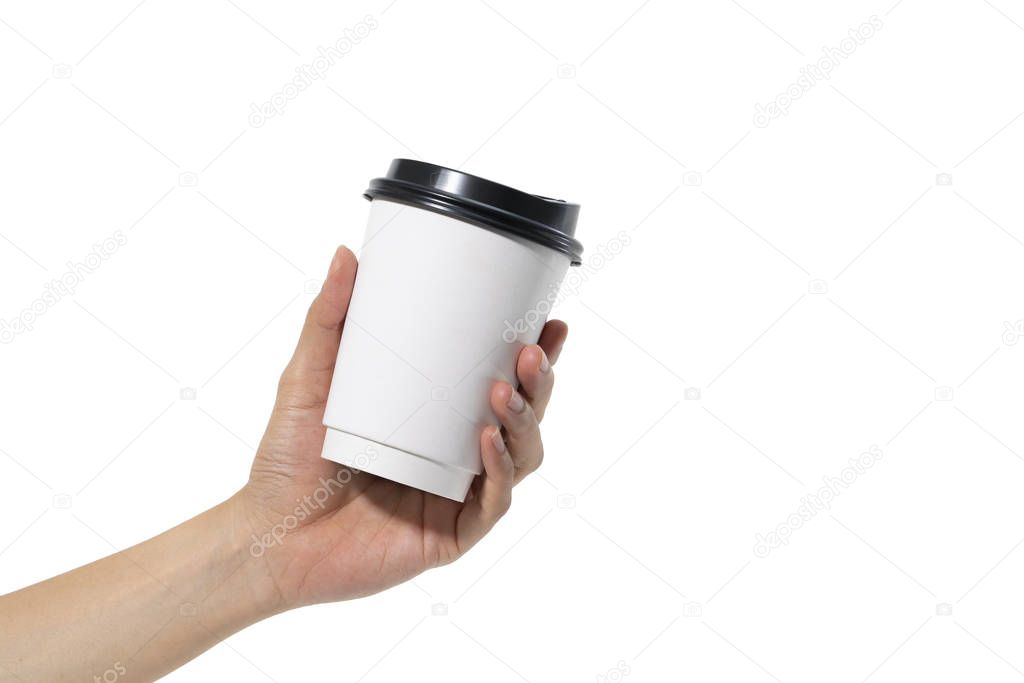 female hand holding a coffee paper cup isolated on white background.