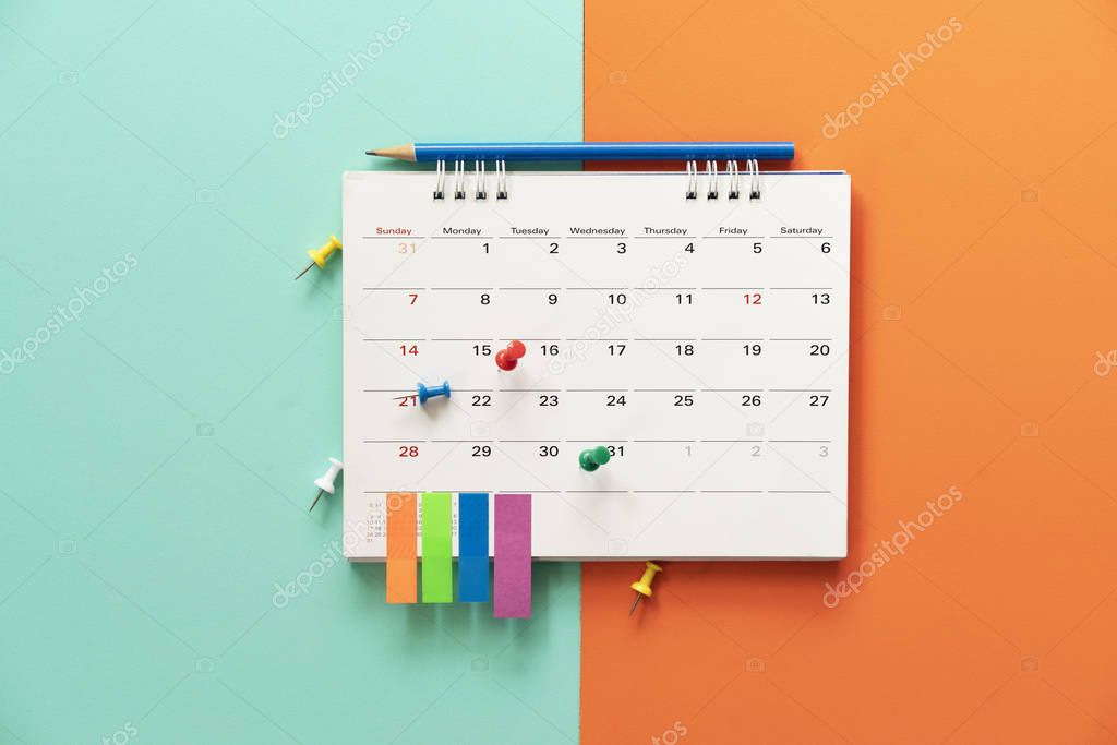 close up of calendar on the table with color background, plannin