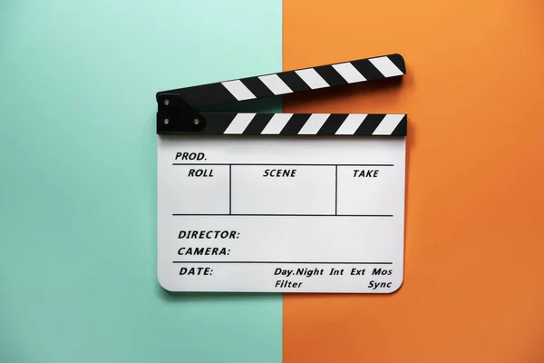 Movie clapper on color table background; film, cinema and video — Stock Photo, Image