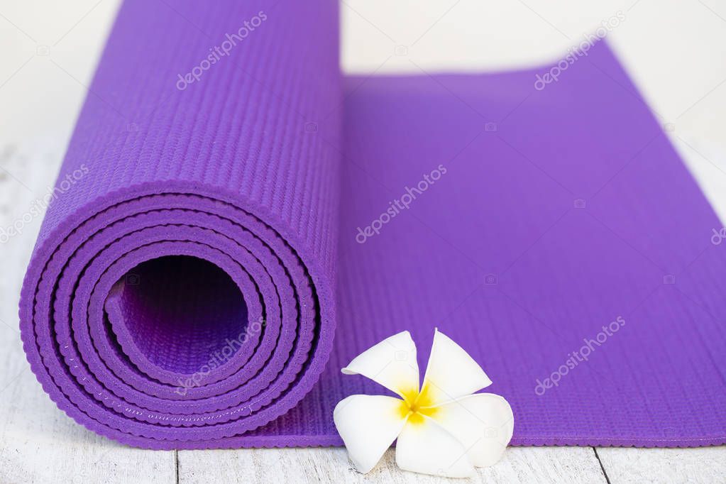 yoga mat and a flower outdoor, healthy and sport concept