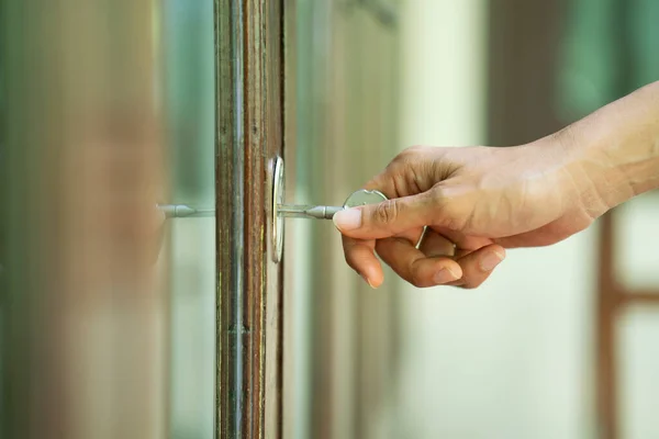 Female Hand Putting House Key Front Door Lock House — Stock Photo, Image