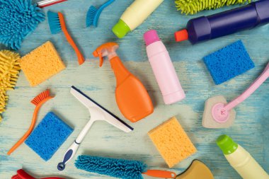 House cleaning plastic product on blue table background, home service or housekeeping concept