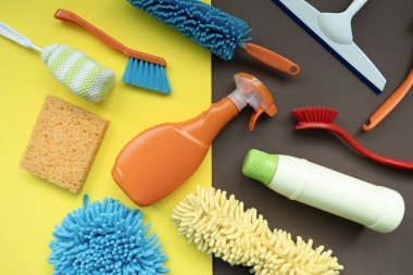 House cleaning plastic product on colorful table background, home service or housekeeping concept