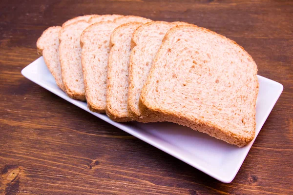 Slices Wholemeal Bread Wooden Table Viewed Close — Stock Photo, Image