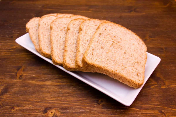 Ломтики Хлеба Цельной Муки Деревянном Столе — стоковое фото