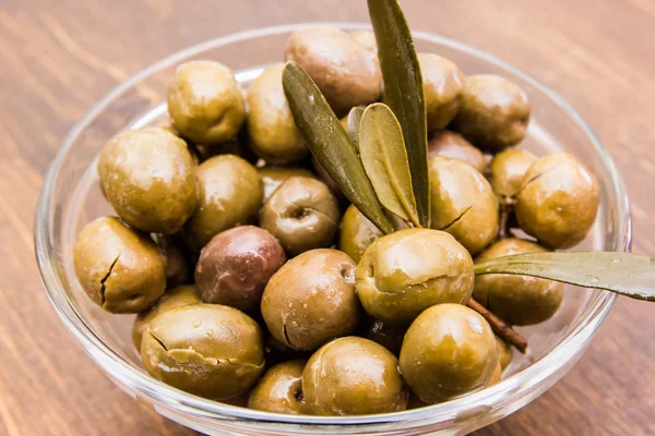 Bowl Olives Olive Branch Wooden Table Seen Close — Stock Photo, Image