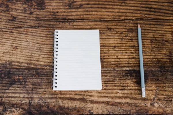 Minimalist Desk Setting Flatlay Opened Ruled Notepad Pencil Dark Wooden — Stok fotoğraf