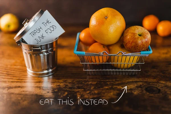 Group Healthy Fruit Shopping Basket Next Junk Food Message Going — Stock Photo, Image