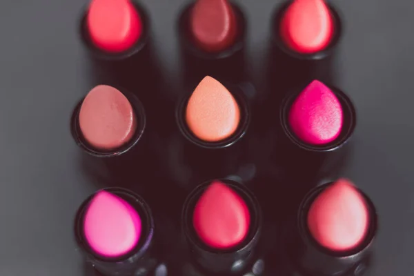 Group Red Pink Nude Lipsticks Lined Dark Table Close Shot — Stock Photo, Image