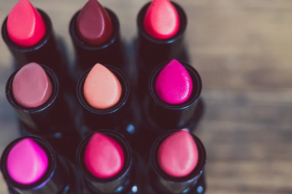 Group Red Pink Nude Lipsticks Lined Wooden Table Close Shot — Stock Photo, Image