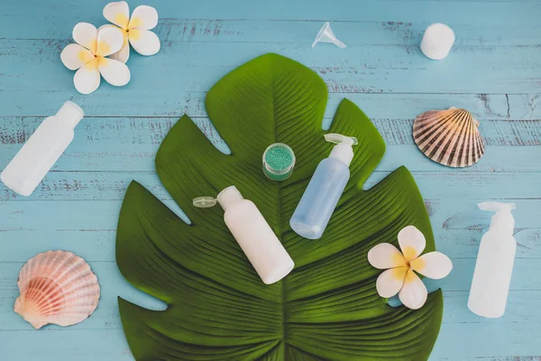 organic lotions and skincare products with tropical flowers and