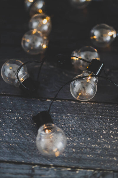 led string lights in shape of lightbulb scattered on wooden tabl