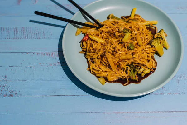 healthy vegetarian noodles with mixed veggies and spicy curry sa