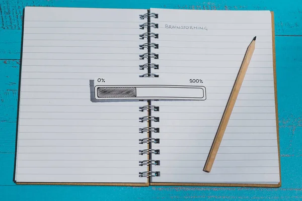 notebook with Brainstorming title on page and progress bar loadi