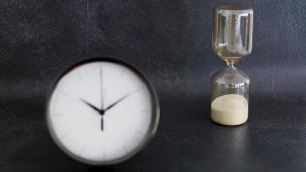 Present Conceptual Still Life Clock Hourglass Symbol Old New Lifestyles — Stock Video