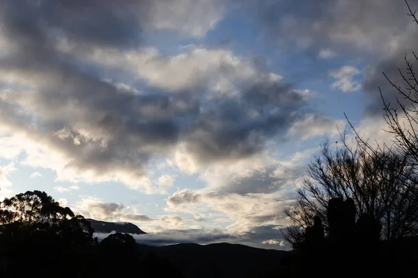sunset sky with beautiful clouds rolling over the hills of Tasmania, Australia