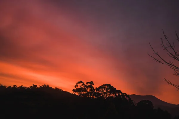 sunset sky with beautiful clouds rolling over the hills of Tasmania, Australia