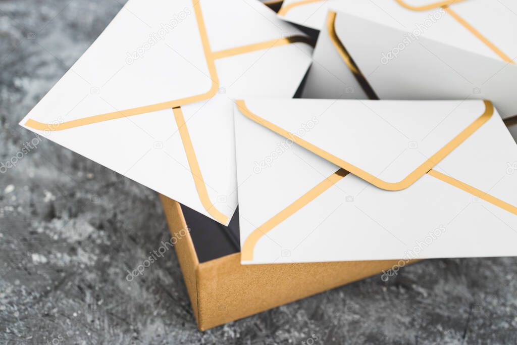 concept of inbox organisation and clean-up, group of envelopes inside box metaphor of email inbox
