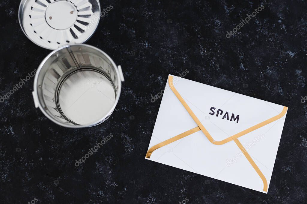 concept of inbox organisation and clean-up, spam email envelopes with trash can