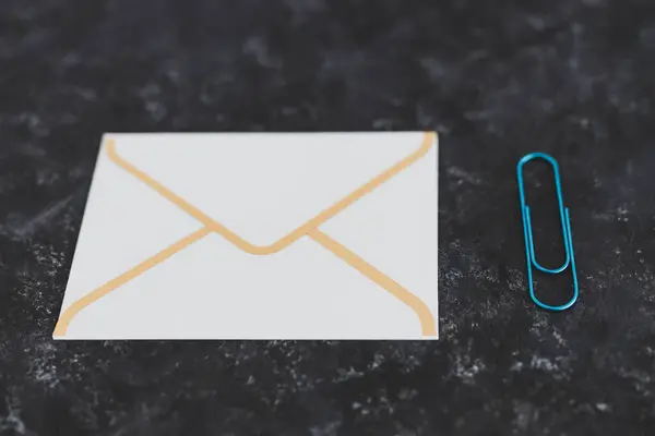concept of email communication, email envelope icon with clip for attachments