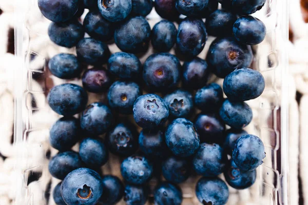 simple food ingredients concept, close-up of fresh blueberries in box