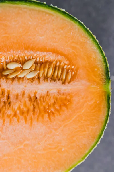 simple food ingredients concept, close-up of rockmelon on cutting board