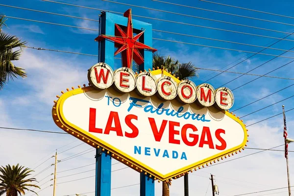 The Welcome to Fabulous Las Vegas sign on bright sunny day in Las Vegas.Welcome to Never Sleep city Las Vegas, Nevada Sign with the heart of Las Vegas scene in the background.