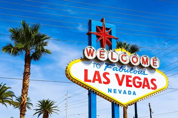 The Welcome to Fabulous Las Vegas sign on bright sunny day in Las Vegas.Welcome to Never Sleep city Las Vegas, Nevada Sign with the heart of Las Vegas scene in the background.