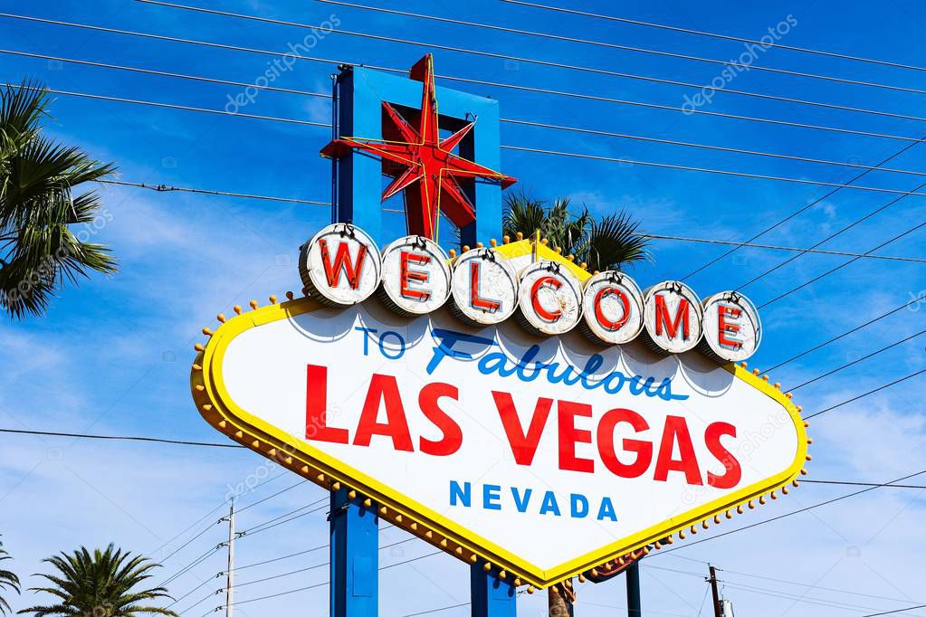 The Welcome to Fabulous Las Vegas sign on bright sunny day in Las Vegas.Welcome to Never Sleep city Las Vegas, Nevada Sign with the heart of Las Vegas scene in the background.