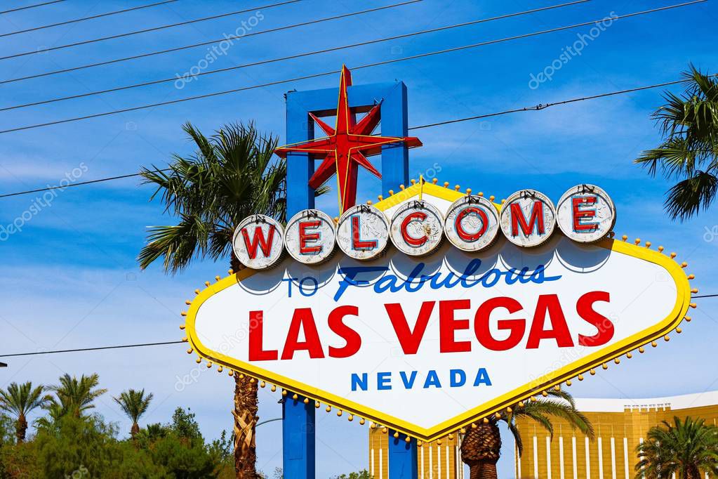 The Welcome to Fabulous Las Vegas sign on bright sunny day in Las Vegas.Welcome to Never Sleep city Las Vegas, Nevada Sign with the heart of Las Vegas scene in the background.