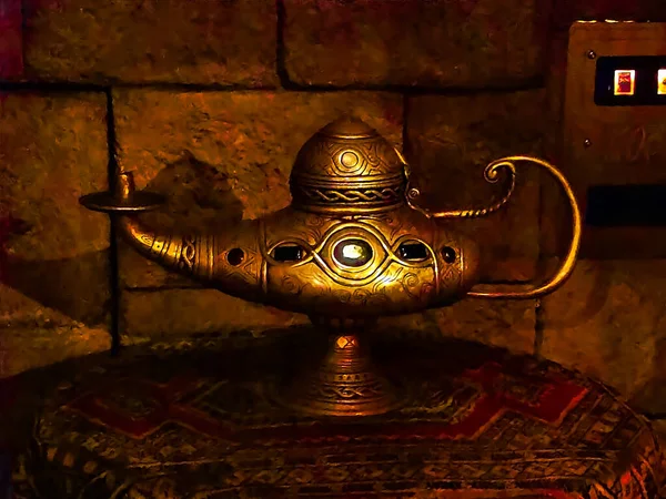 Antique artisanal Aladdin Arabian nights genie style oil lamp with soft light