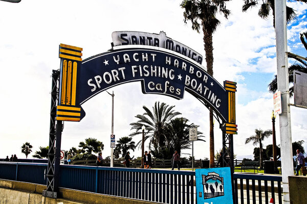 Los Angeles,CA/USA - Oct 29, 2015 : Welcoming arch in Santa Monica, California. The city has 3.5 miles of beach locations.Santa Monica Pier, Picture of the entrance with the famous arch sign. 