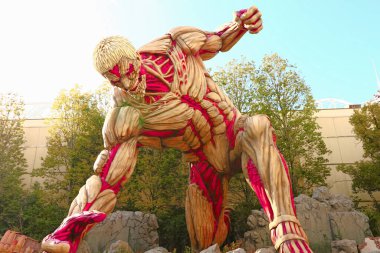 Osaka, Japan - Jan 21 2017:Attack on Titan attraction opens at Universal Studios japan captures the scale of the life-size statue / Shingeki no Kyojin clipart