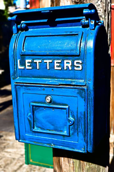 Antique Blue Letter Box on the Telegraph made of wood.Vintage metal mail box.Front view of Very Old (Vintage) big blue US Postal mail box.