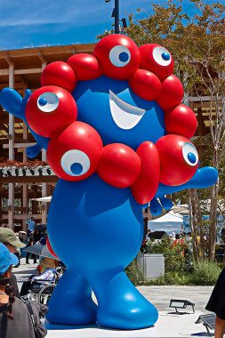 OSAKA,JAPAN - AUG 22 2025 : Editorial photograph of MYAKU MYAKU, the official mascot character of the 2025 Osaka Kansai Expo.Located in front of the West Gate of the Expo, it welcomes visitors.