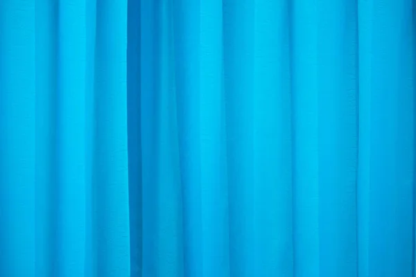 Blue folded curtain nice as background or texture