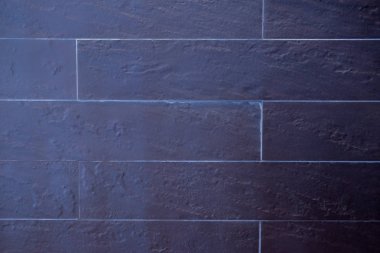 Siyah tuğla duvar görünümünü kapatın. Ev dekorasyon konsepti ve soyut arka plan