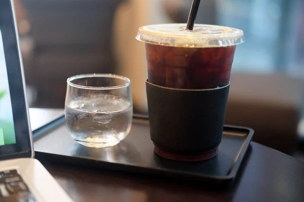 Ice black coffee or long black coffee in plastic cup